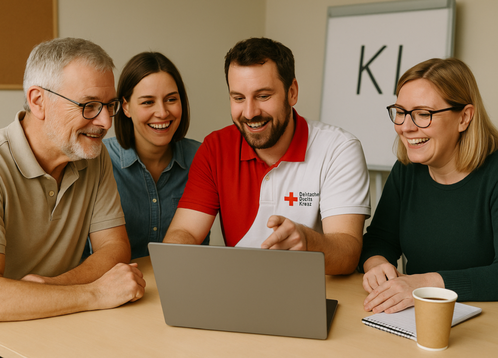 Vier Menschen arbeiten gemeinsam an einem Laptop